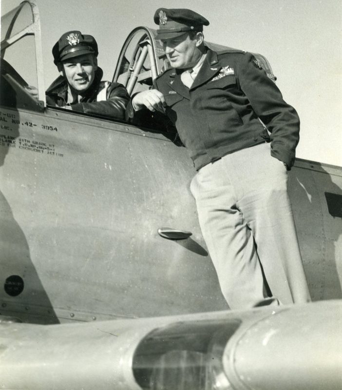 Bob Burns seated in the cockpit of a T-6 Texan trainer with an officer named Kinnard standing on the wing, Nashville, late 1940s